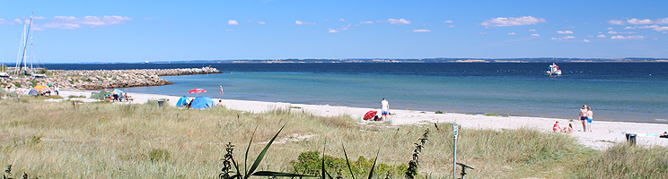 Fine sandy beach and lovely bathing water on the beach, Sydstranden, next to the marina in Fynshav Fine sandy beach and lovely bathing water on the beach, Sydstranden, next to the marina in Fynshav