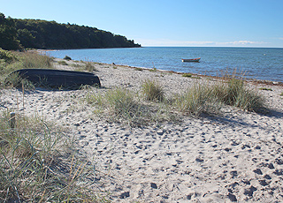 Båd på vandet i den sydlige del af bugten ved Høve Strand Båd på vandet i den sydlige del af bugten ved Høve Strand