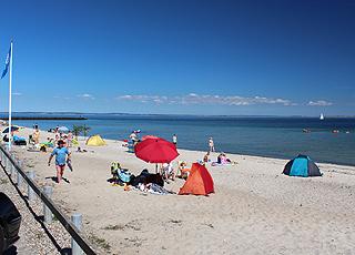 Lovely bathing beach with blue flag in the holiday area Mommark Lovely bathing beach with blue flag in the holiday area Mommark