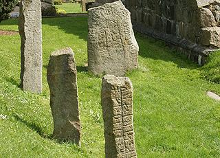 Runic stone by the church ruin from the year 1225 in Østermarie Runic stone by the church ruin from the year 1225 in Østermarie