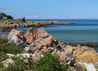 Beautiful cliff formation along the shore in Sandkås Beautiful cliff formation along the shore in Sandkås