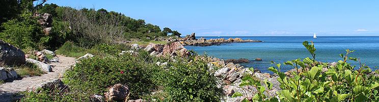 You can follow a path along the beautiful rocky coast in Sandkås You can follow a path along the beautiful rocky coast in Sandkås