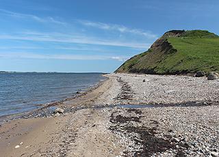View of the 60 metres high molar clay hill, Hanklit, from the beach in Sundby, Mors View of the 60 metres high molar clay hill, Hanklit, from the beach in Sundby, Mors
