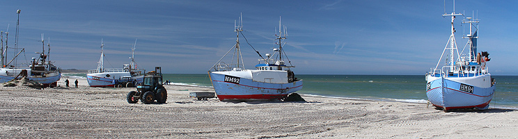 Fishing boats on the beach in Thorup Strand Fishing boats on the beach in Thorup Strand