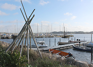 In the cosy marina in Virksund you will find fishing boats and yachts side by side In the cosy marina in Virksund you will find fishing boats and yachts side by side